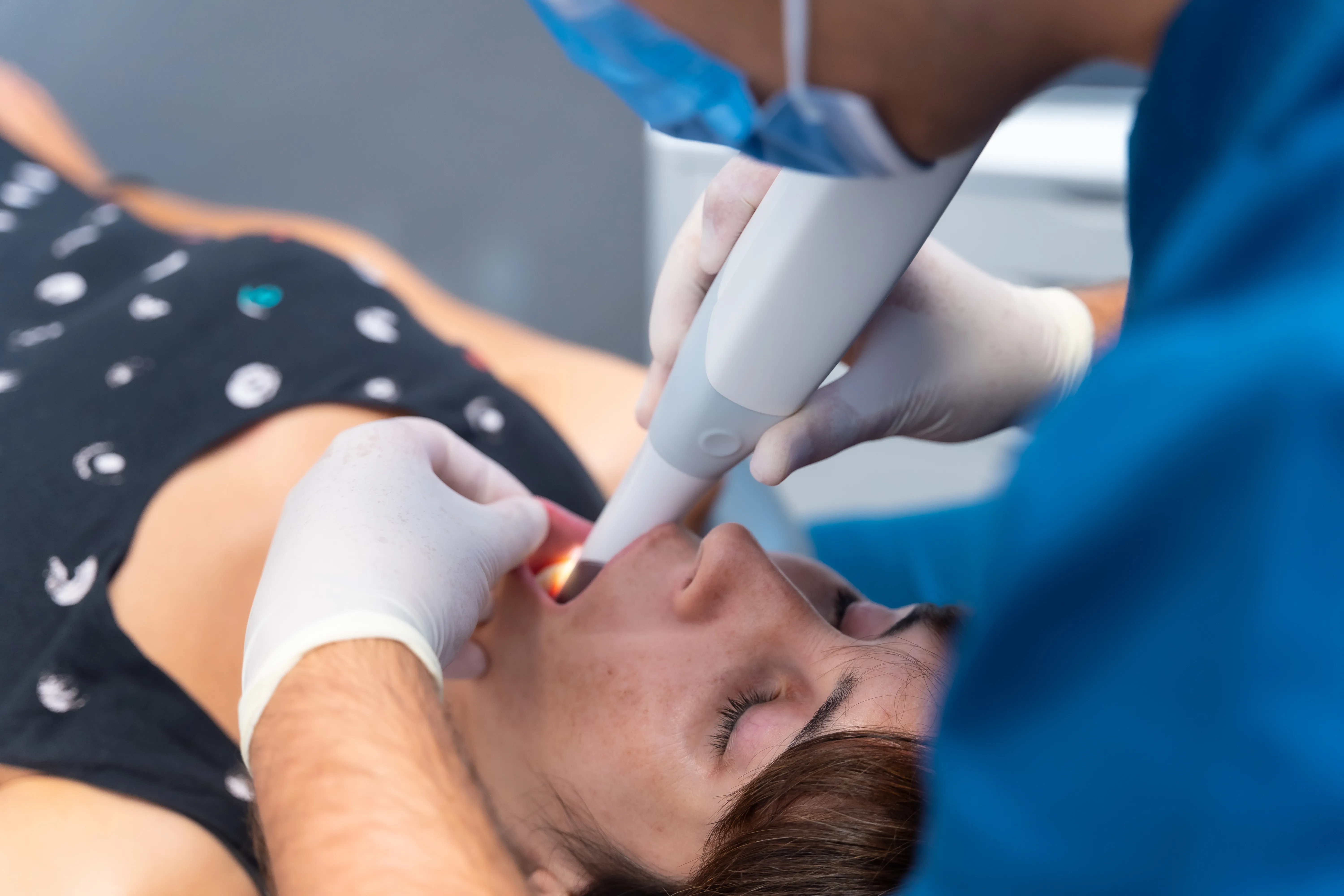 Patient receiving an intraoral scan