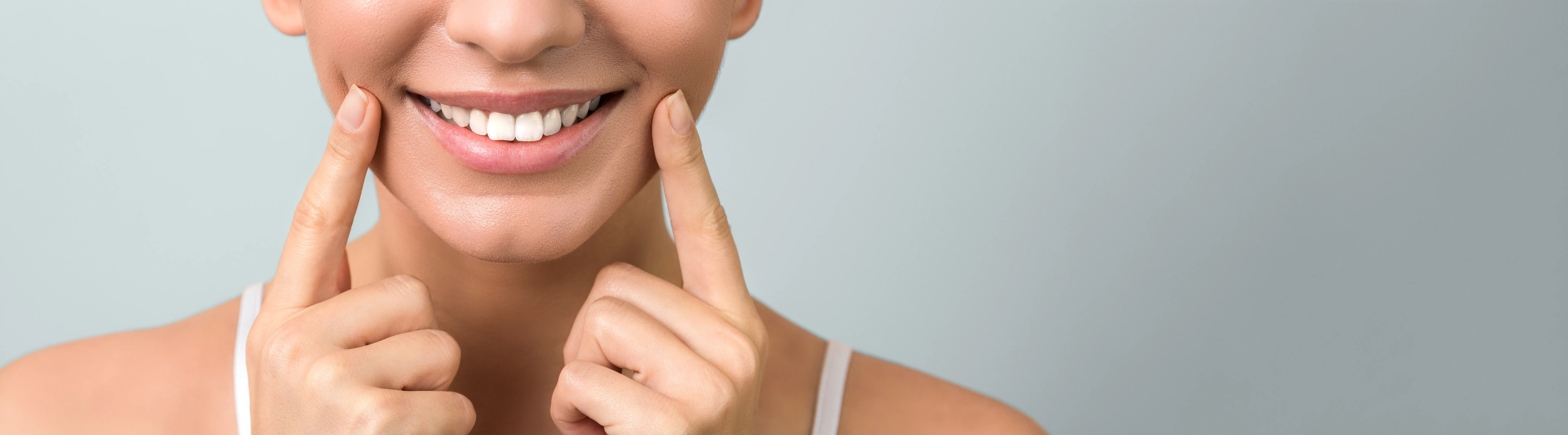 Patient smile after implant bridge treatment