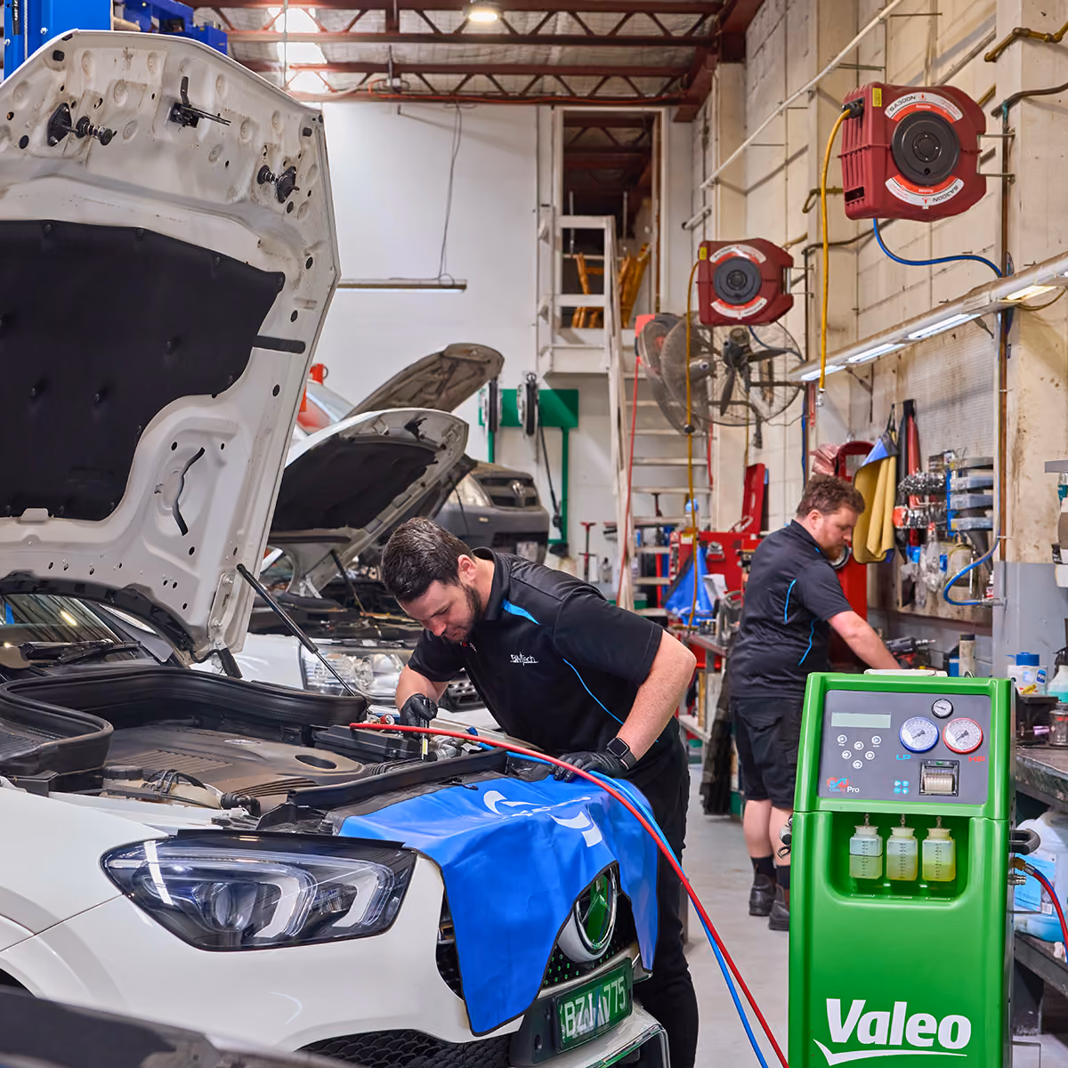 Vehicle in workshop receiving air conditioning diagnostics and servicing in Melbourne auto repair facility.