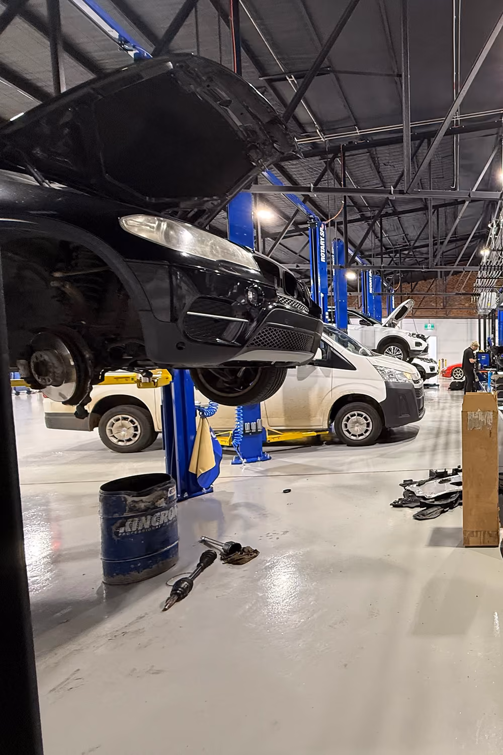 Range Rover on hoist during mechanical repair.