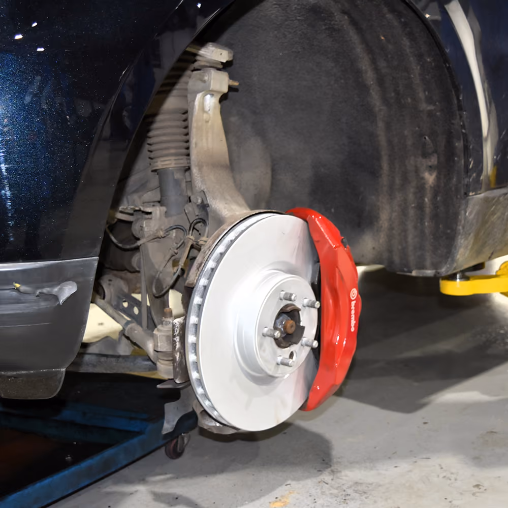 New brake components fitted to a Range Rover during a brake service.