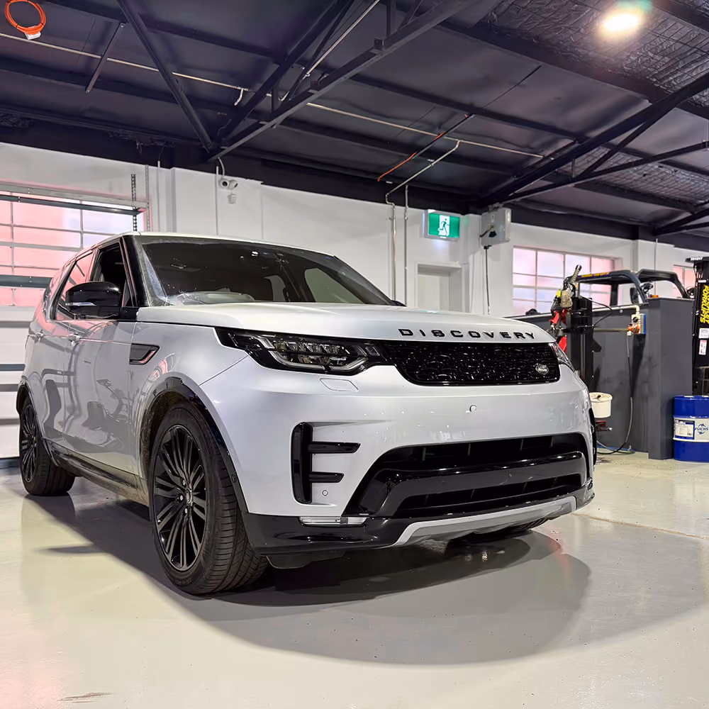 Land Rover Discovery parked inside the Auto Tech Group workshop.