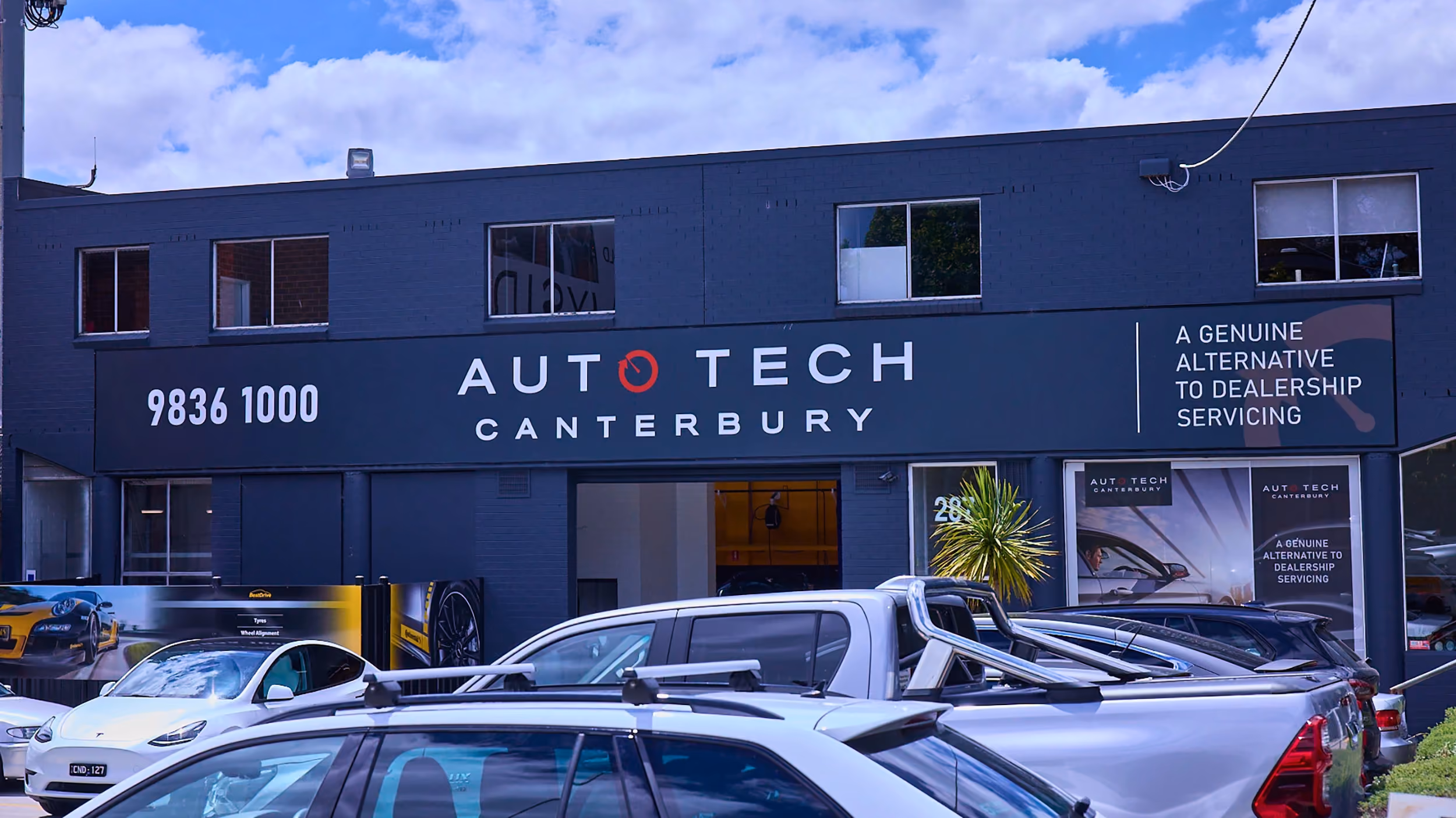 Canterbury Auto Tech Group workshop interior with vehicles in the service bays.