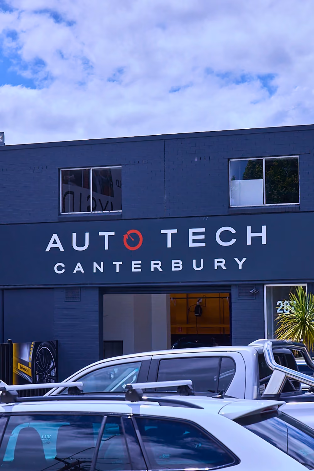 Canterbury Auto Tech Group workshop interior with vehicles in the service bays.
