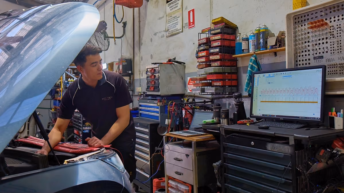 Technician using diagnostic software to inspect a fleet vehicle at Auto Tech Group.