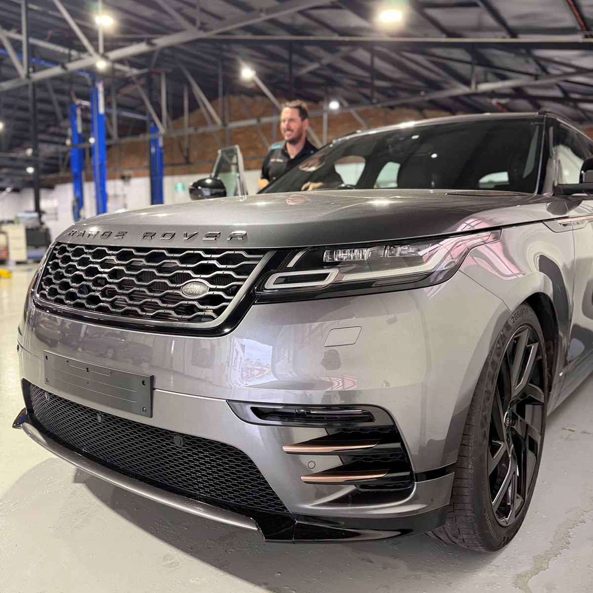 Grey Range Rover with Steve Adams in the background at Auto Tech Malvern.