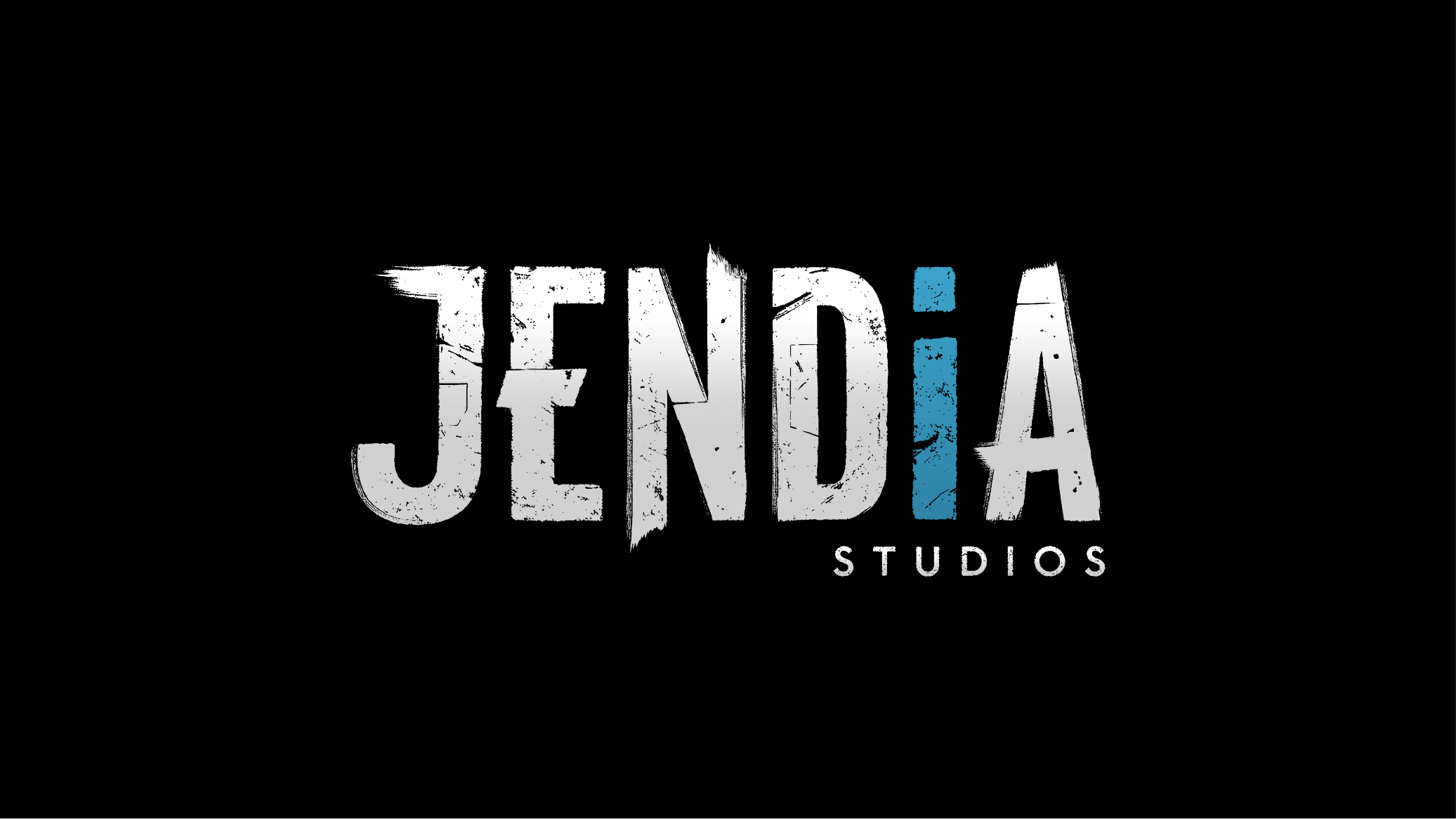 JENDiA Studios logo with the word 'JENDiA' in distressed white uppercase text on a black background, the letter 'i' in blue, and 'STUDIOS' in smaller white letters underneath.