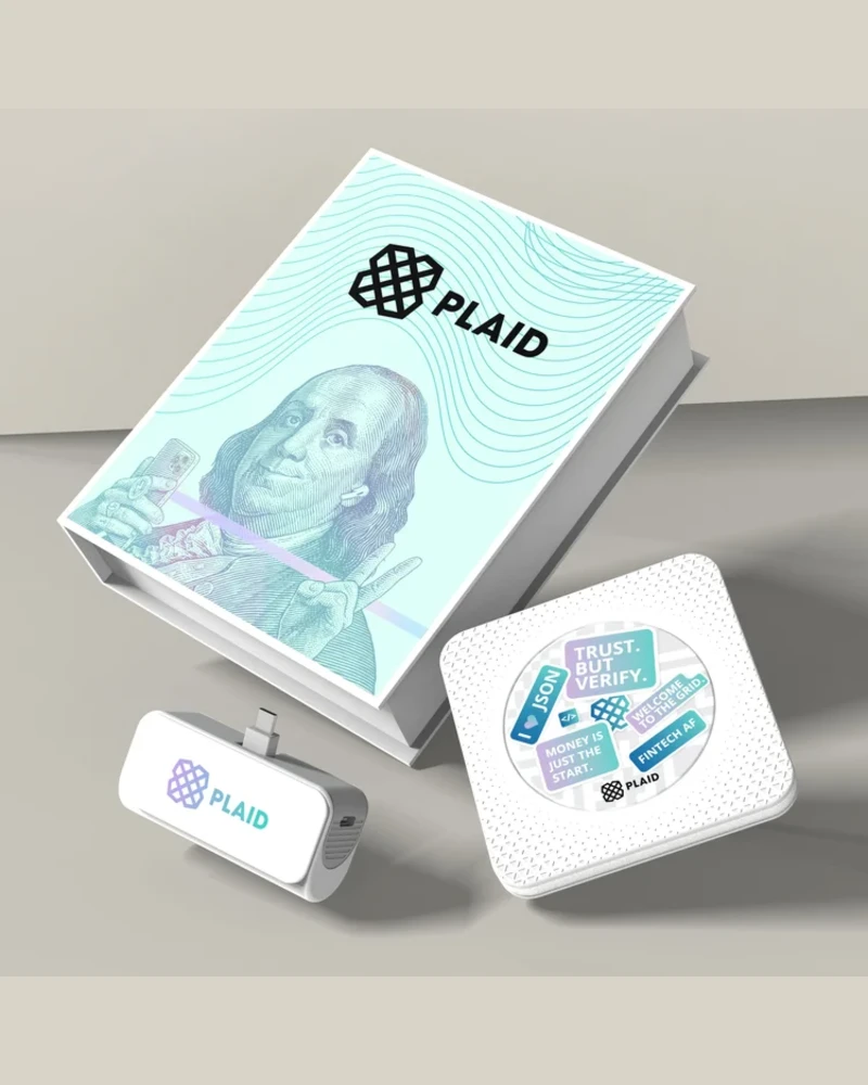 Custom branded kit render including a packaging box, portable charger, and sticker pad