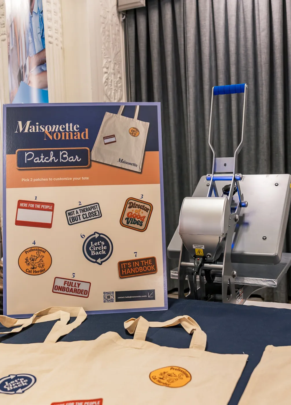 The Maisonette Nomad Patch Bar menu board showing seven custom patch designs next to a heat press