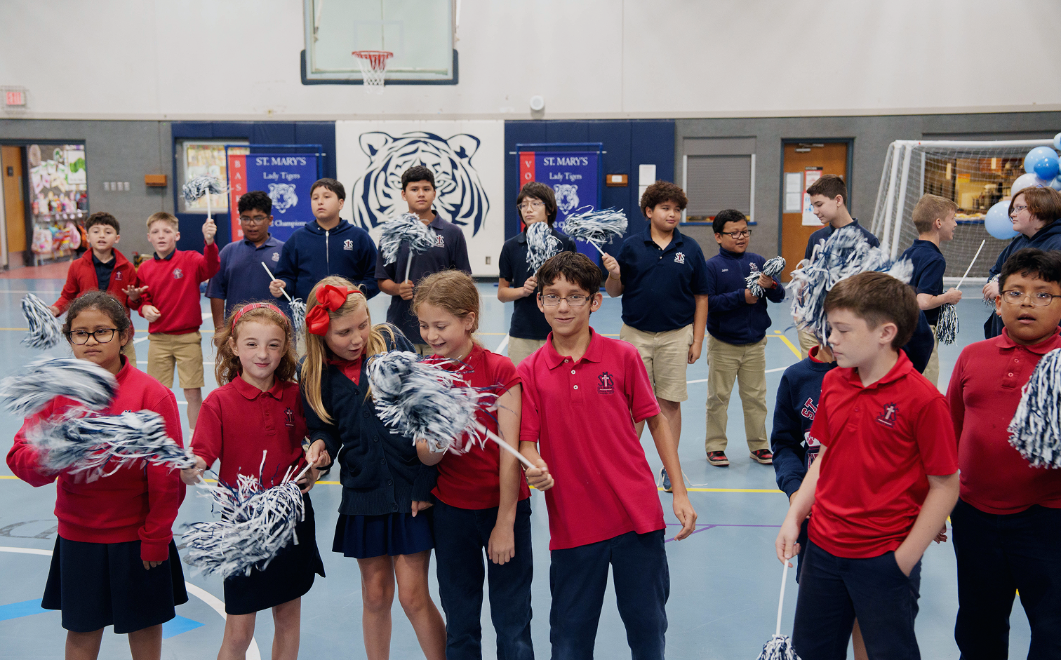 St. Mary's students waving pom-poms during a school pep rally