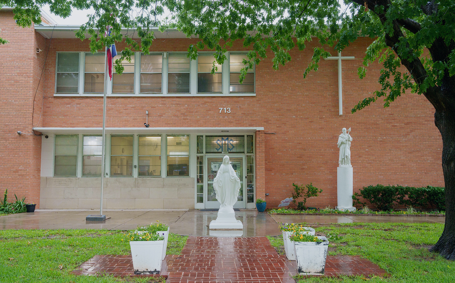 Exterior of Saint Mary's Catholic school building with religious statues
