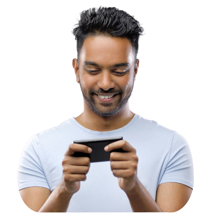 Man smiling while holding his phone horizontally