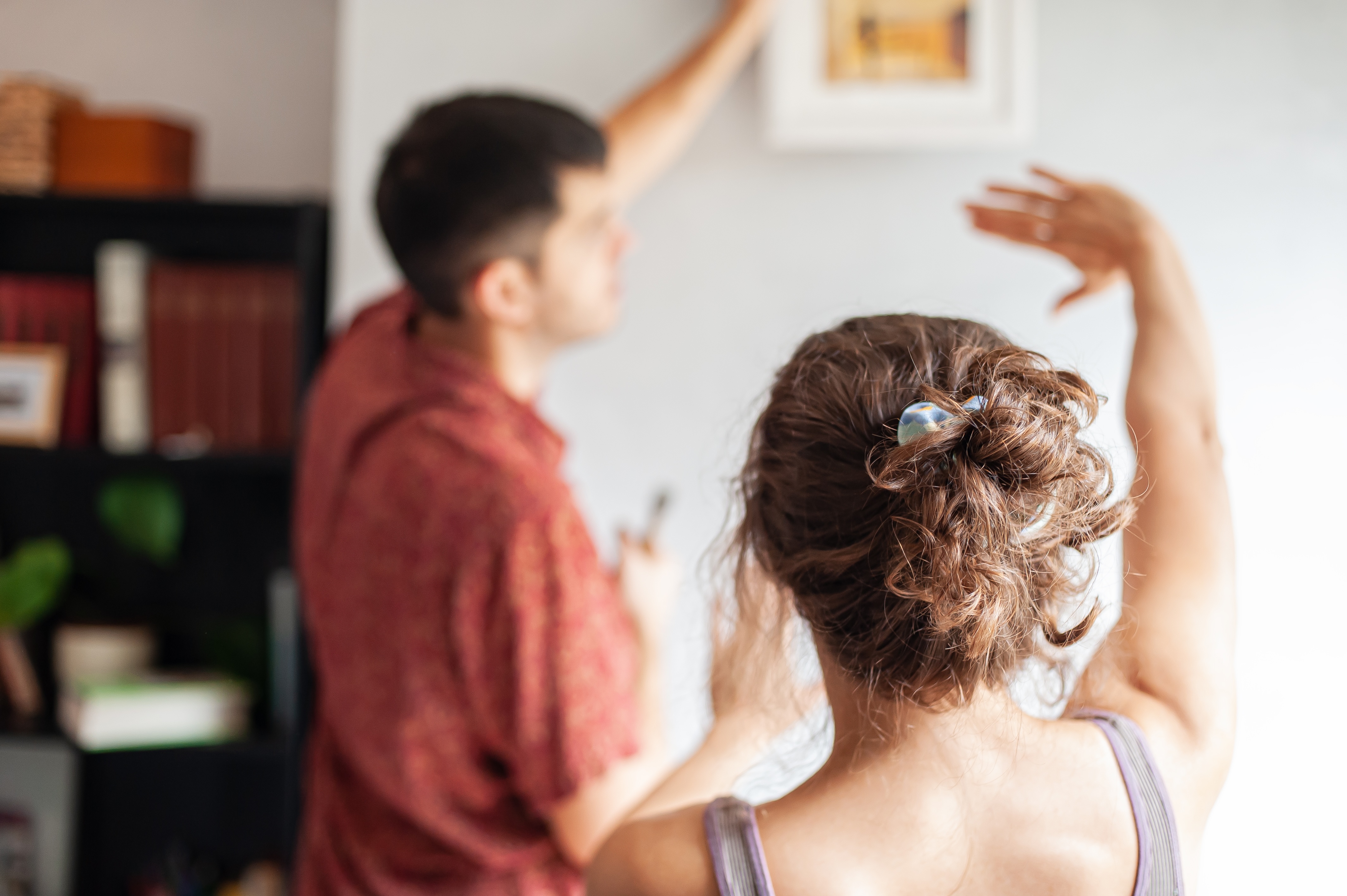 Couple putting up painting stock photo