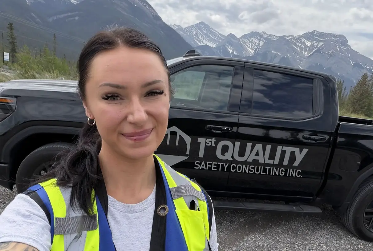 Marlys standing in front of her work truck