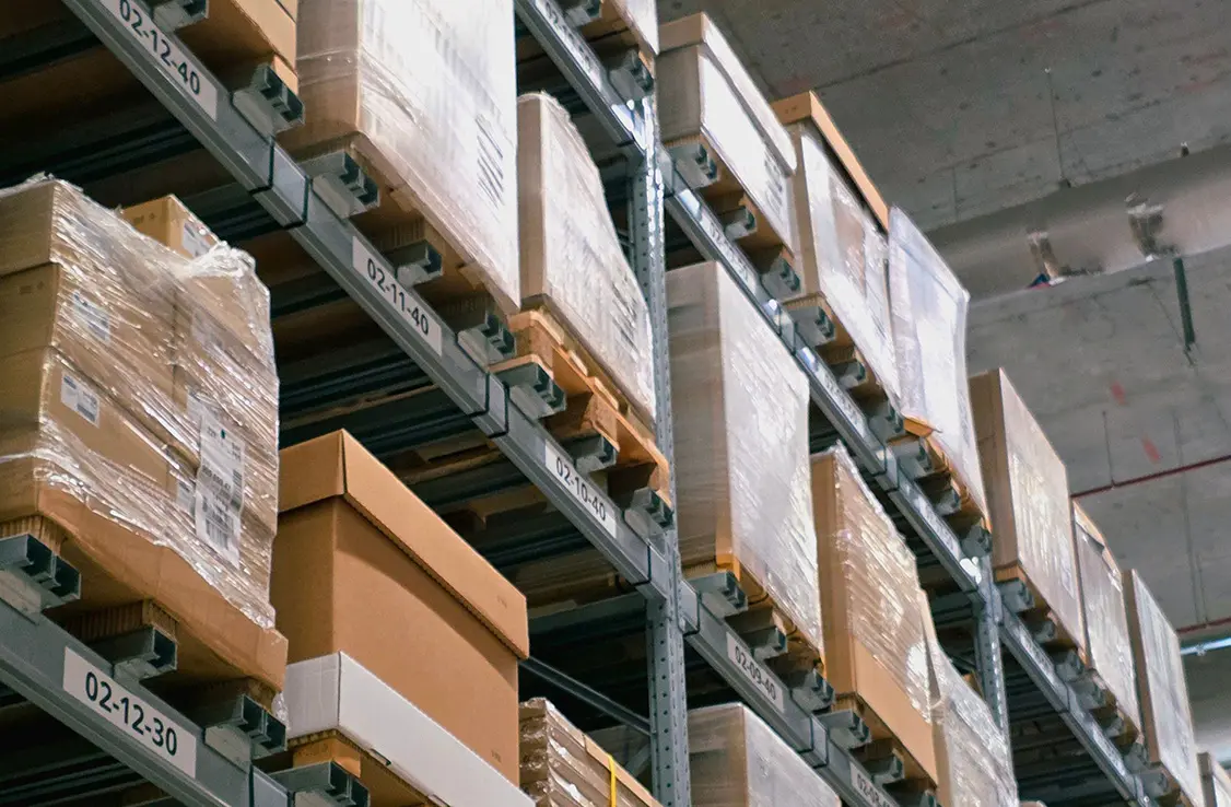 boxes on shelf in large storage warehouse