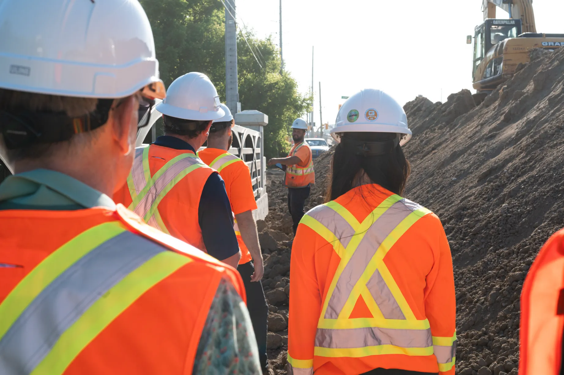 Large group of workers observing worksite