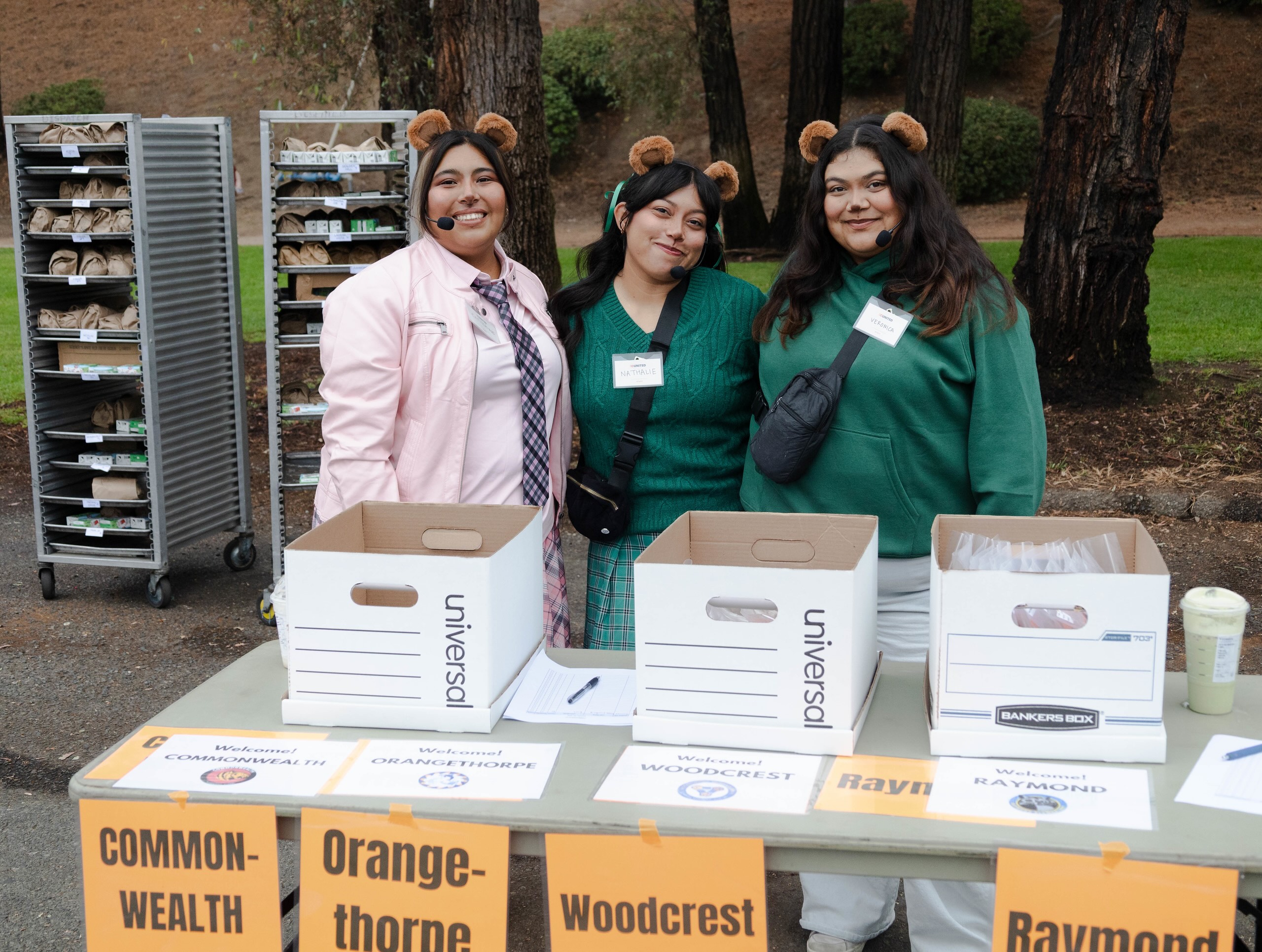 Pumpkin Run 5K volunteers next to Fullerton School District sign up table