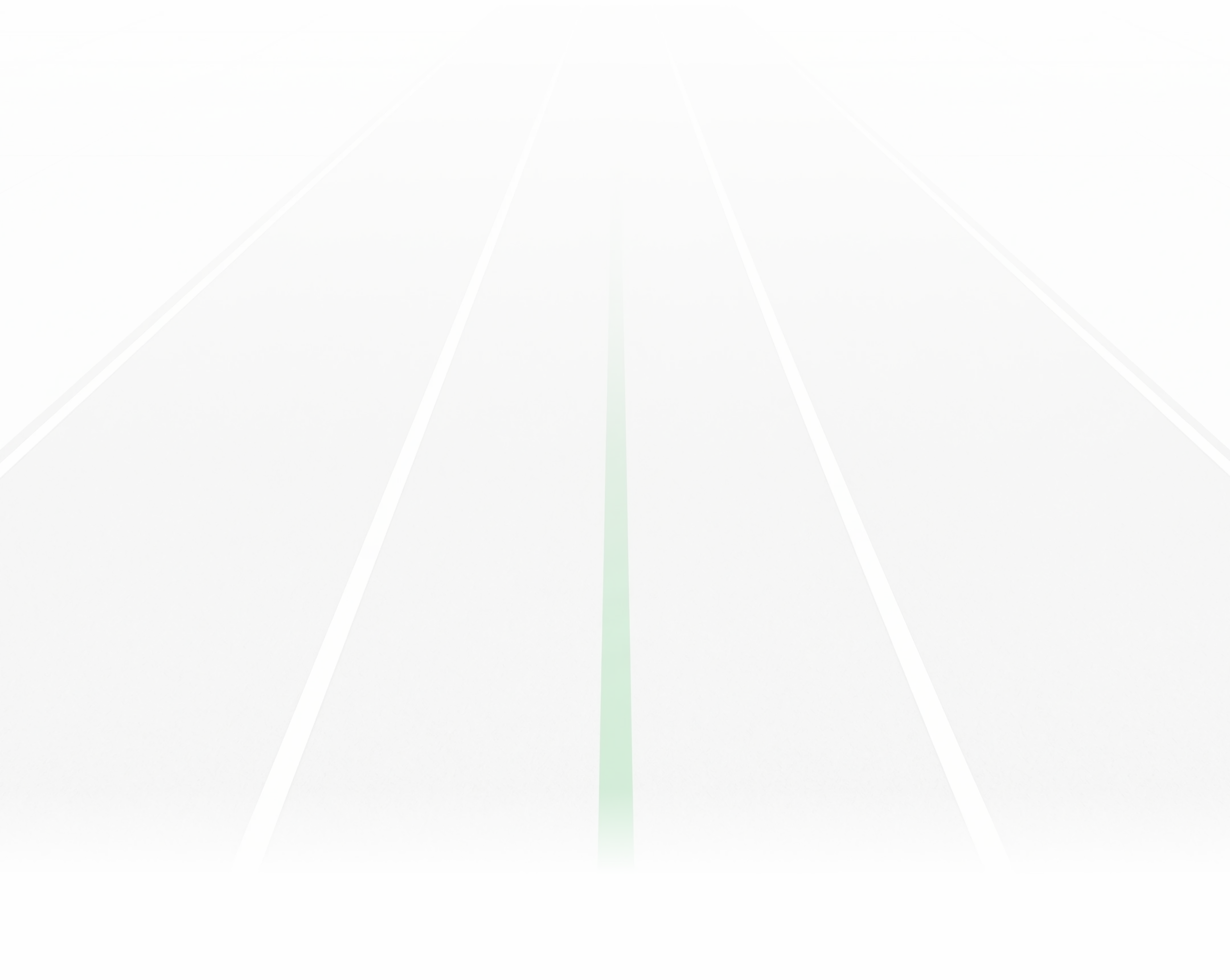Gray running track lanes with a green center line fading into white in the distance.