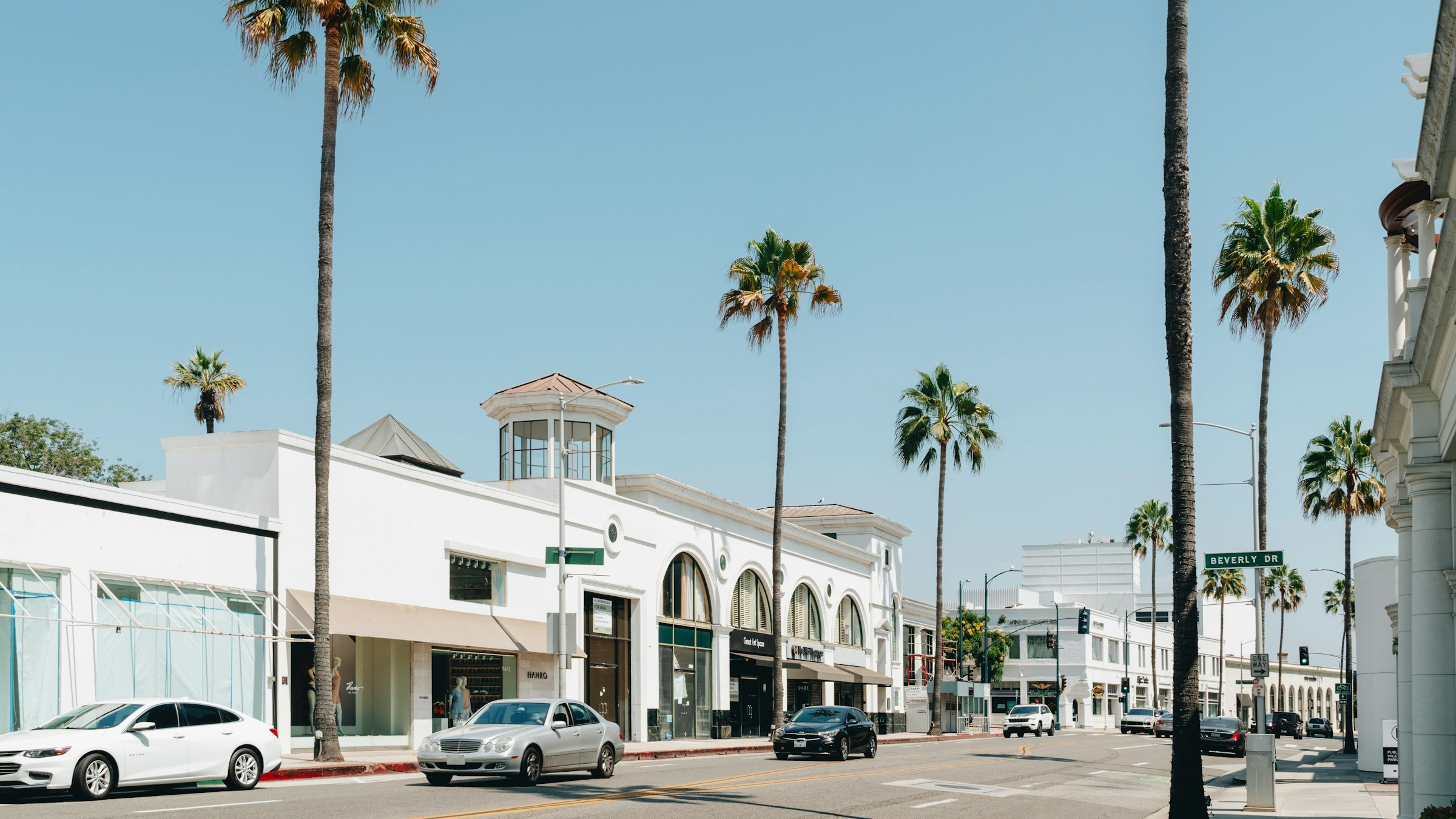 Palm lined street of shops in Beverly Hills