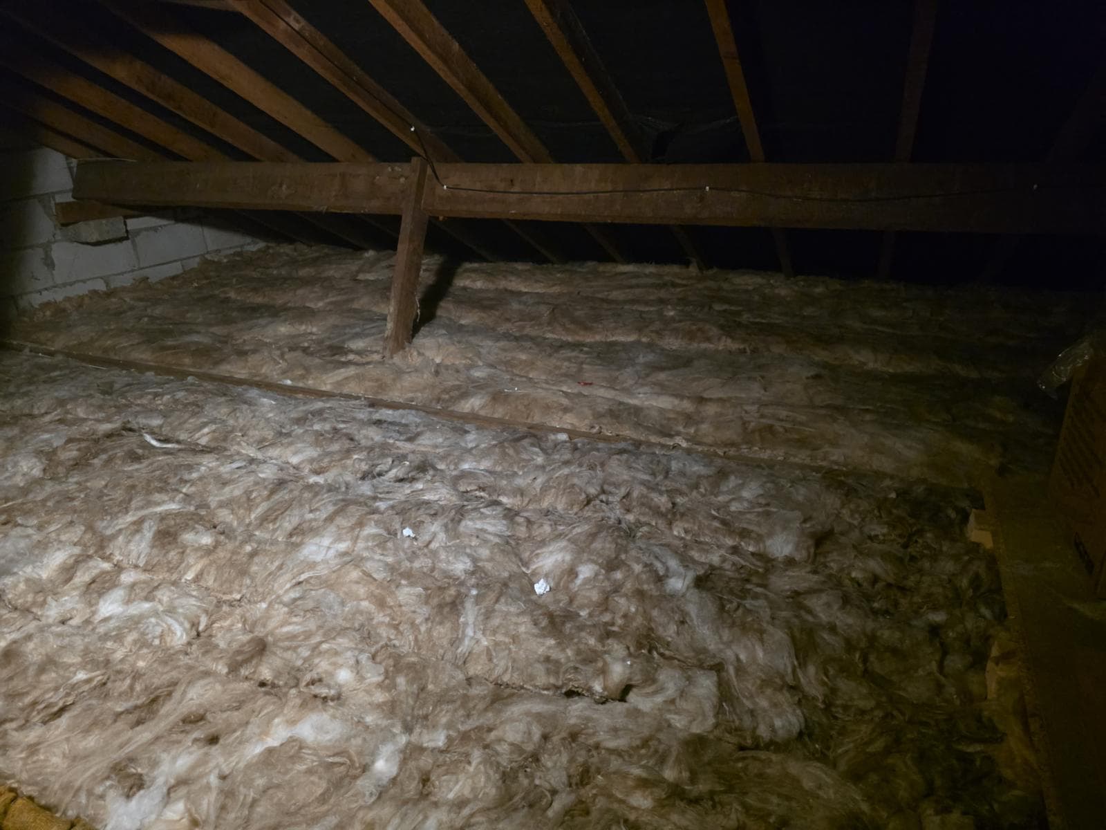 Roof insulation work in progress on a residential home