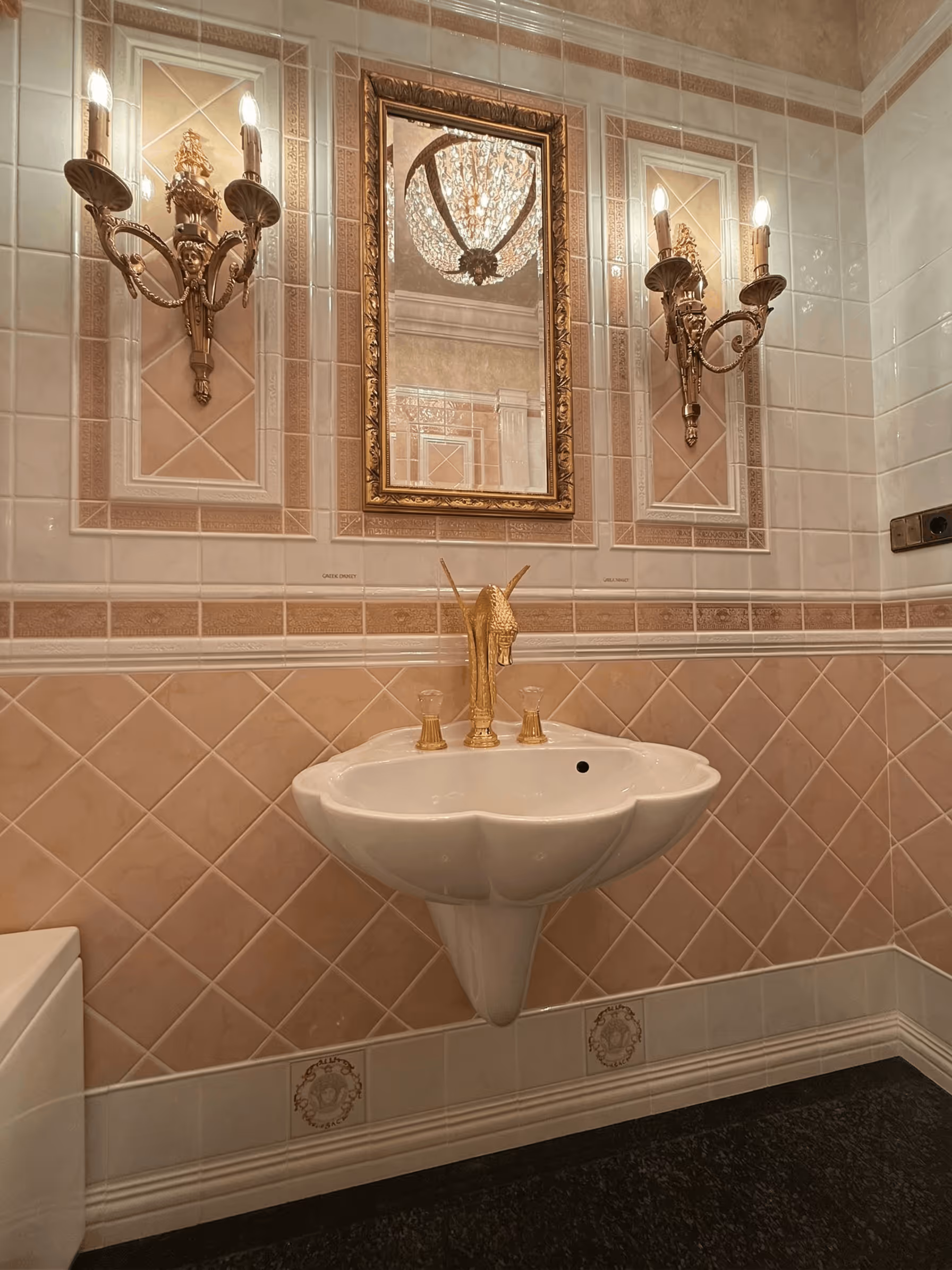 Elegant bathroom sink with gold fixture shaped like a horse head beneath a decorative mirror and wall sconces.