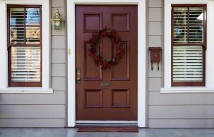 A front door with a woodgrain finish