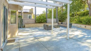Exterior view of a concrete patio with patio doors