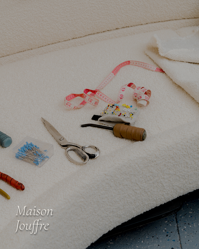 Traditional upholstery tools and fabric craftsmanship at Maison Jouffre ateliers