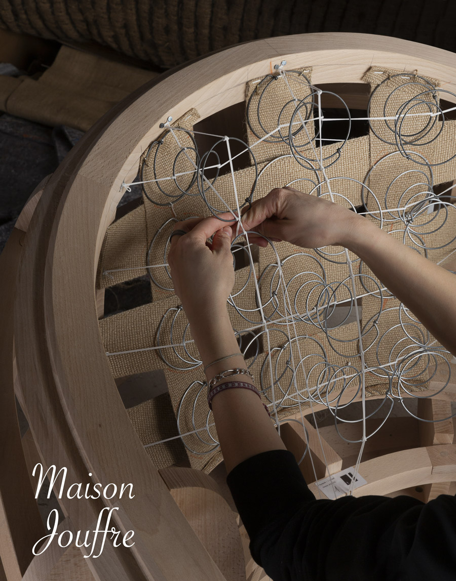 Traditional upholstery tools and fabric craftsmanship at Maison Jouffre ateliers