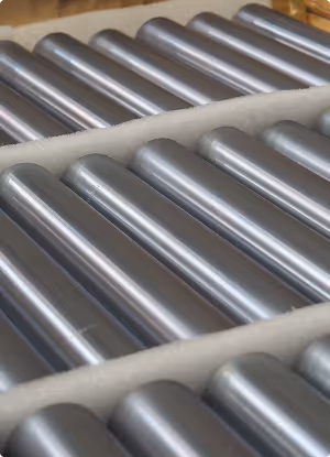 Rows of metal cylindrical rods arranged in foam packaging for protection.