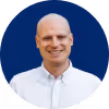 A headshot of Jake Harris, a business and mindset coach, and owner of Upperlimit Coaching.