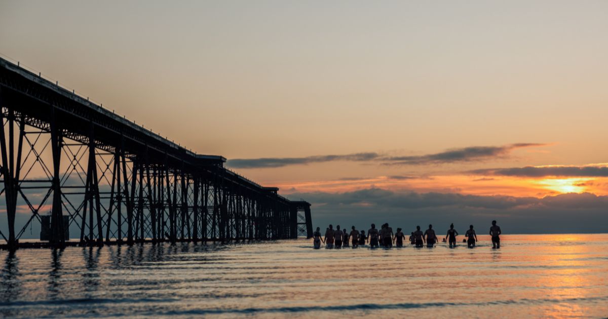 People enjoying the outdoors together at sunset
