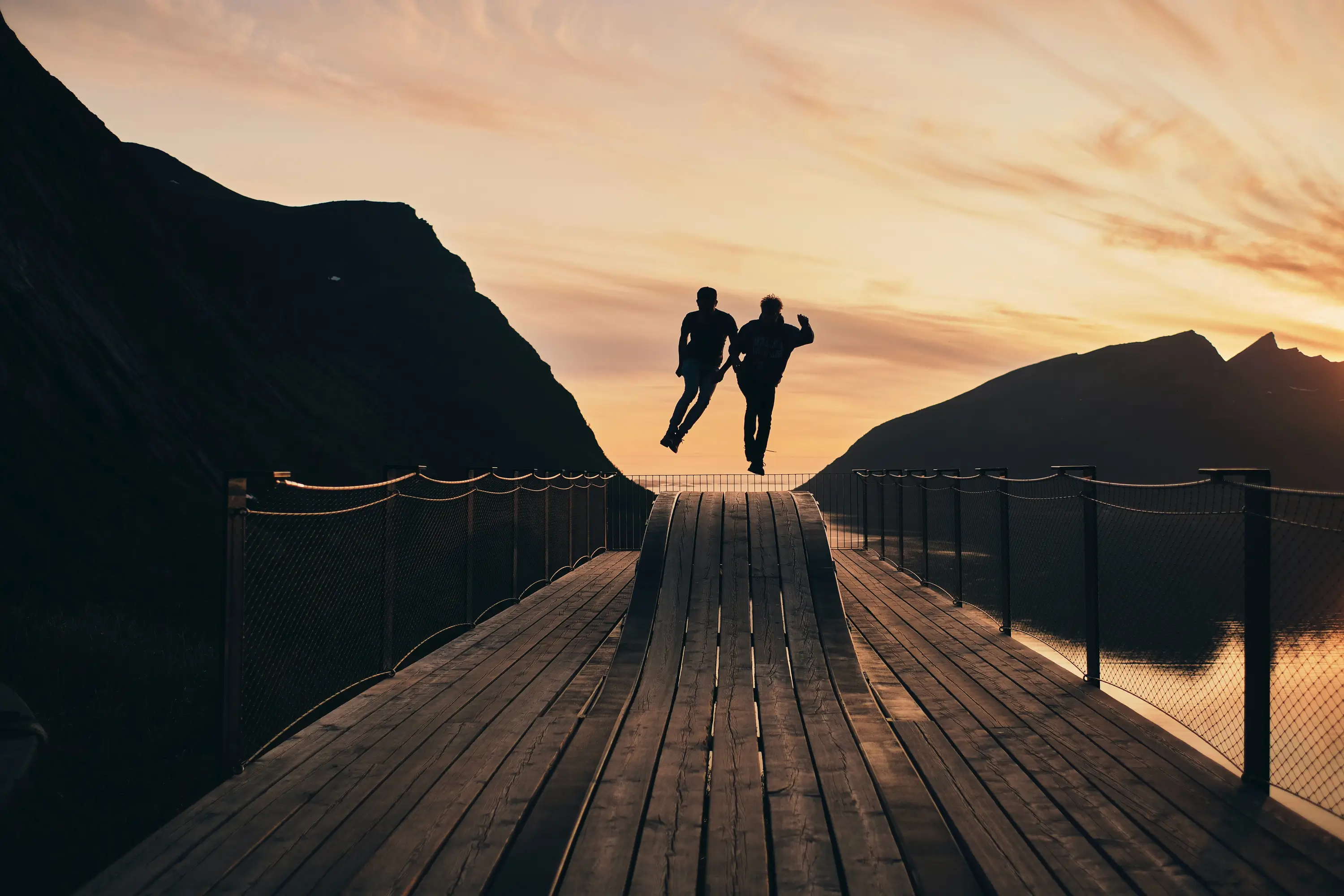 Two people jumping for joy to represent the importance of healthy vendor and supplier relationships