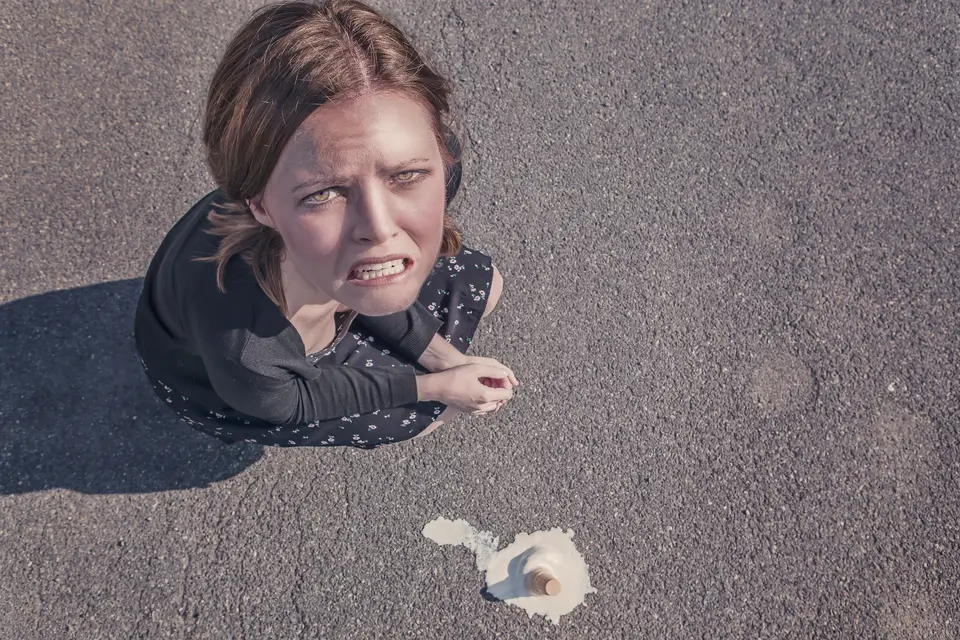 Woman bemoaning a dropped ice cream cone to represent the current need for rapid digital transformation in procurement.