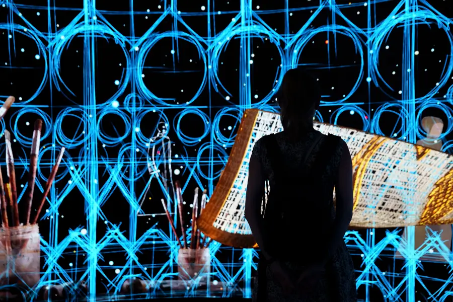 image of woman looking at a virtual grid to represent the need to adopt innovative technology to enhance agility in procurement