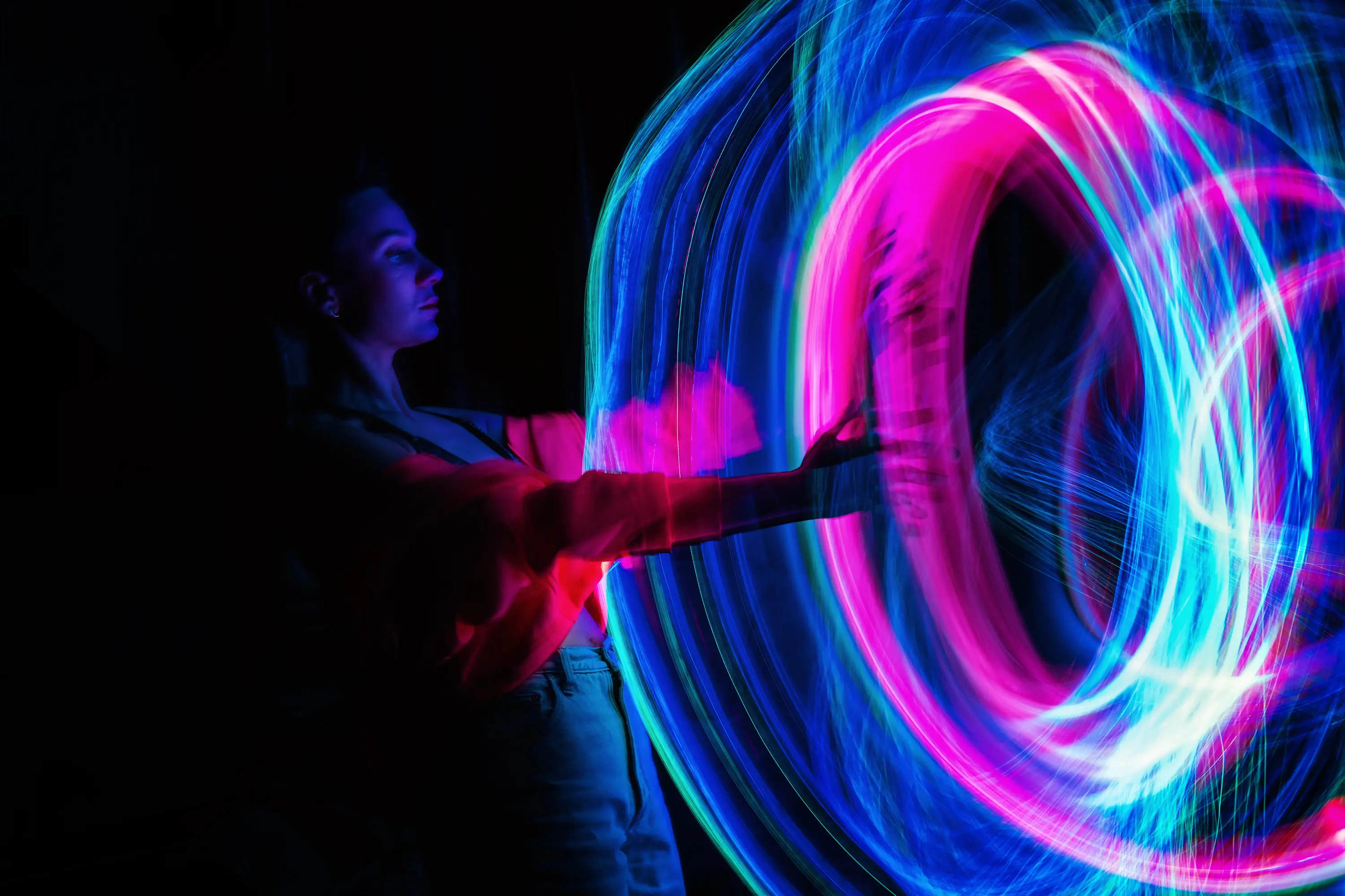A woman walking into a futuristic portal to represent the need for digital transformation in procurement