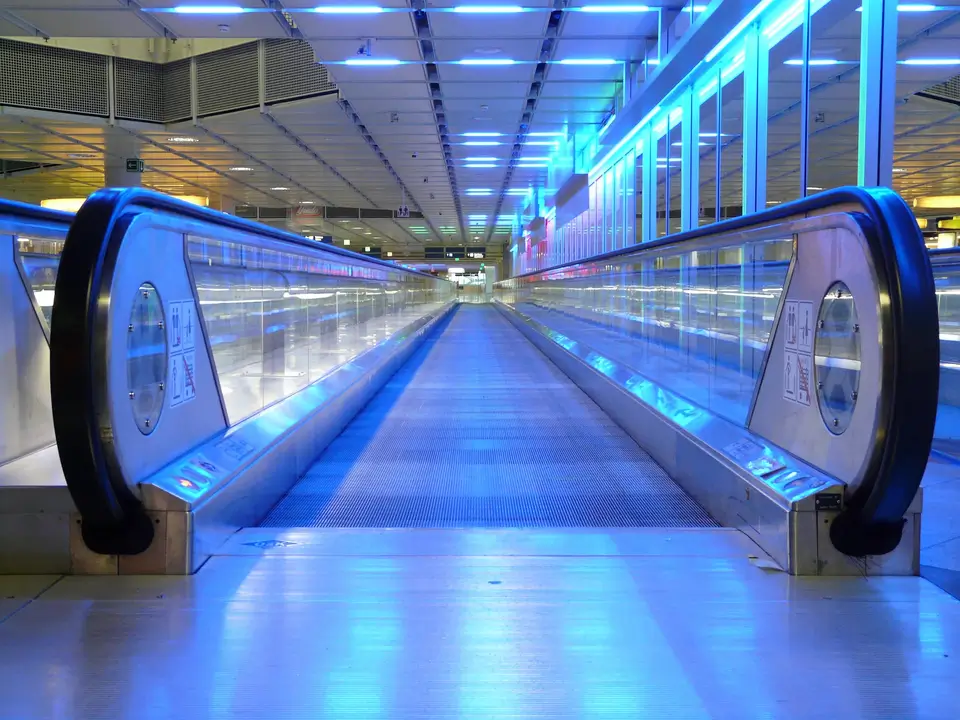 A moving walkway enabling others to expedite their travels much like supplier enablement expedites procurement value creation.