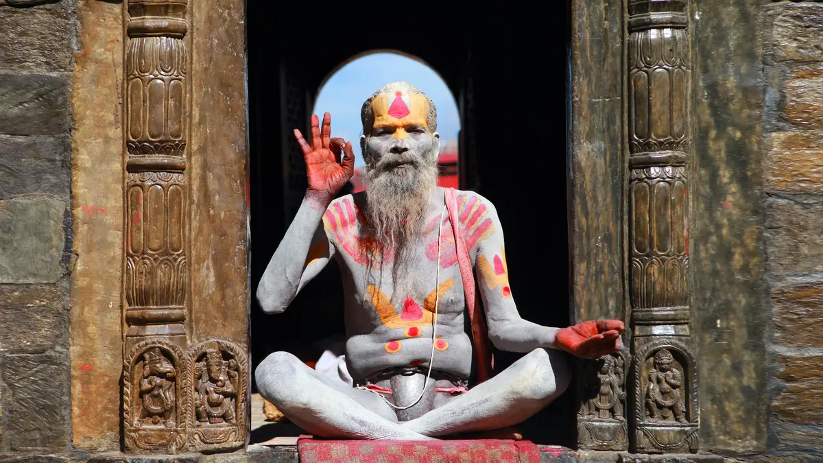 A Nepalese wiseman meditating in a window to symbolize the wisdom behind three way matching.