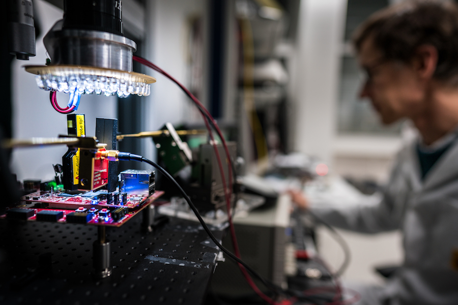 A person testing a device for iot security in the Kudelski iot labs