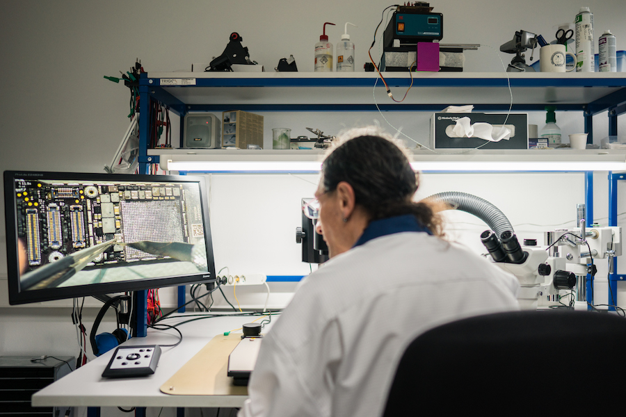A person working in the kudelski iot security labs