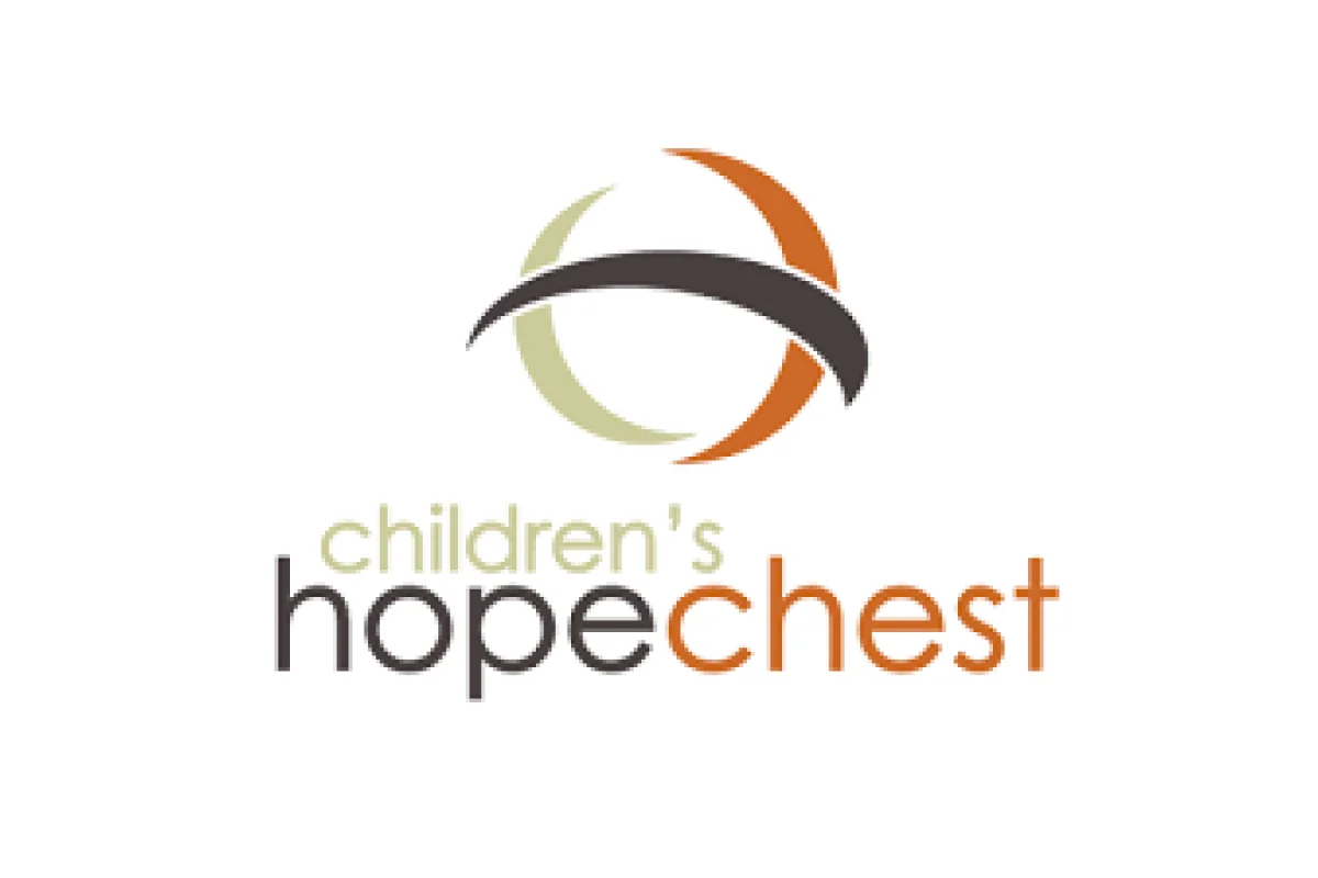 Children's Hope Chest charity logo with circular design in beige, brown, and orange colors.