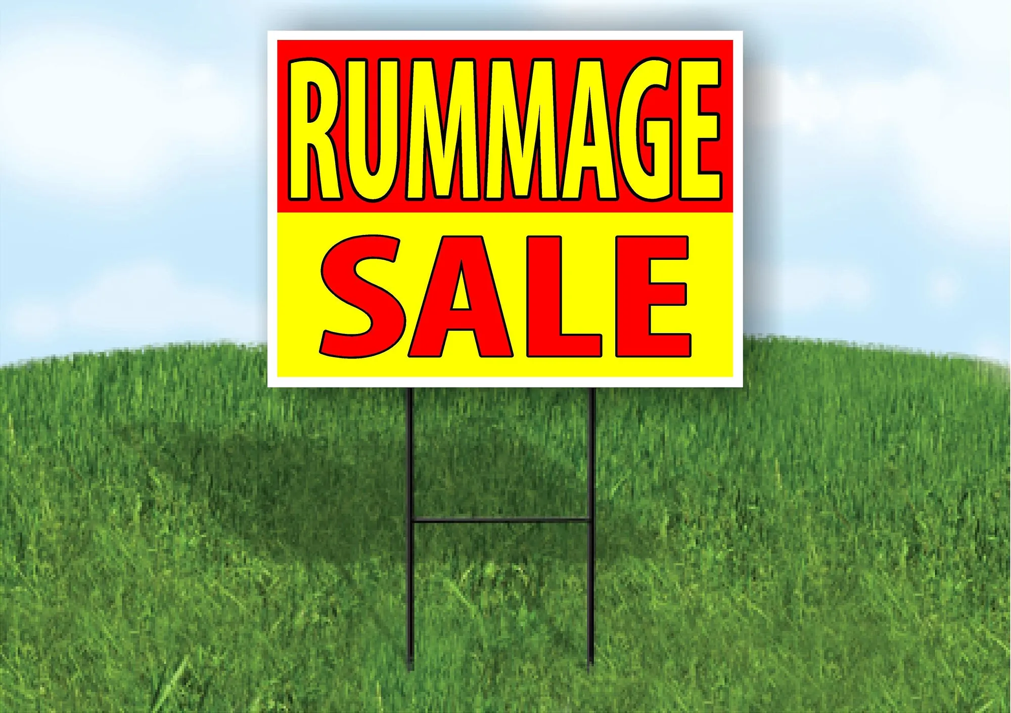 Red and yellow Rummage Sale yard sign staked in green grass under a blue sky.