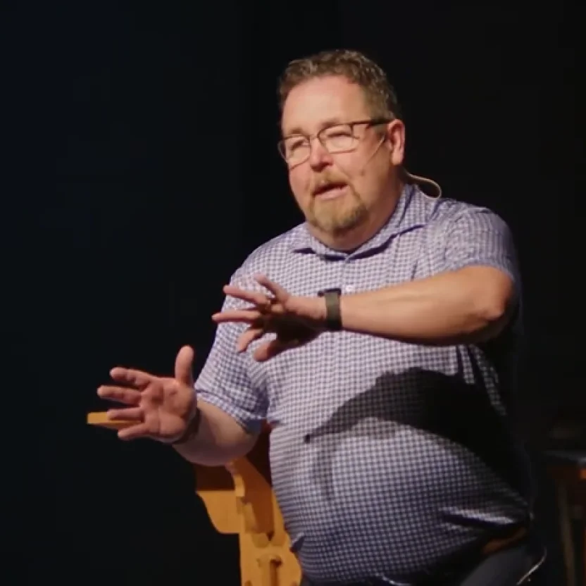 Man speaking on stage.