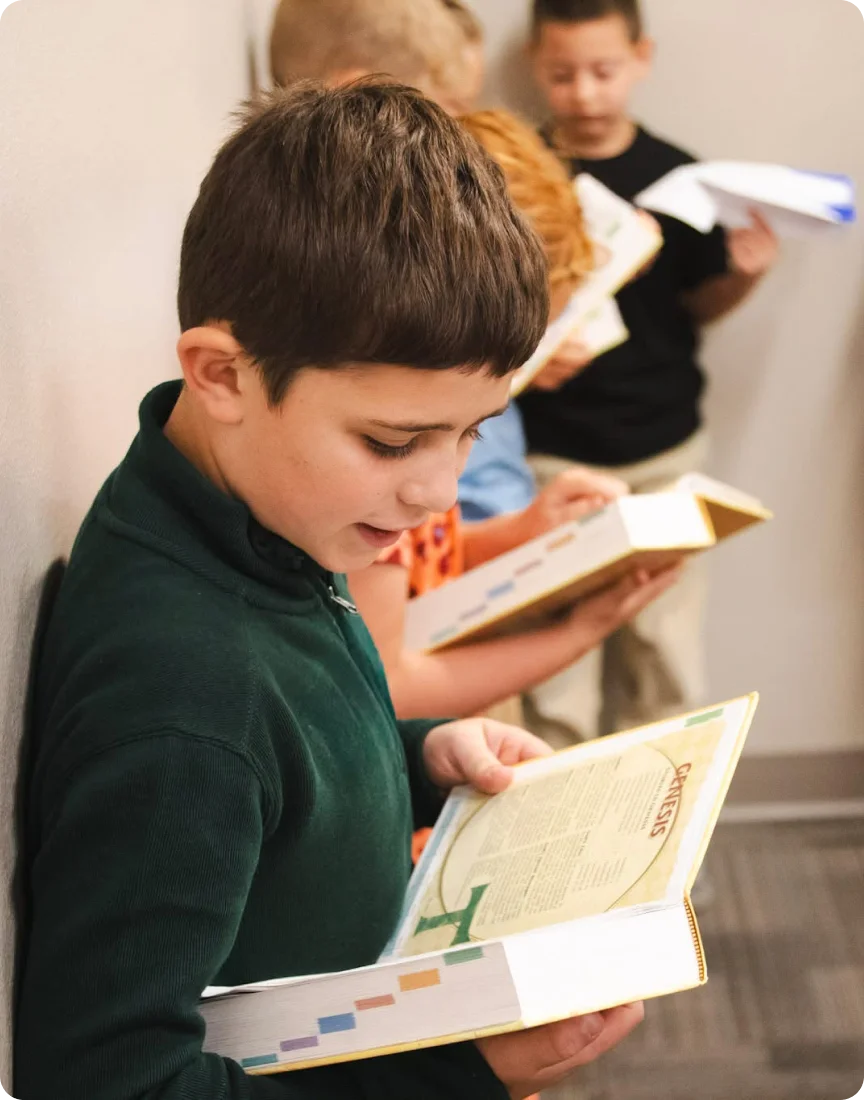A boy reading the bible.