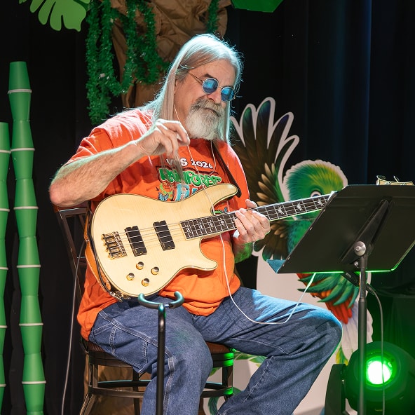 Man sitting with guitar.