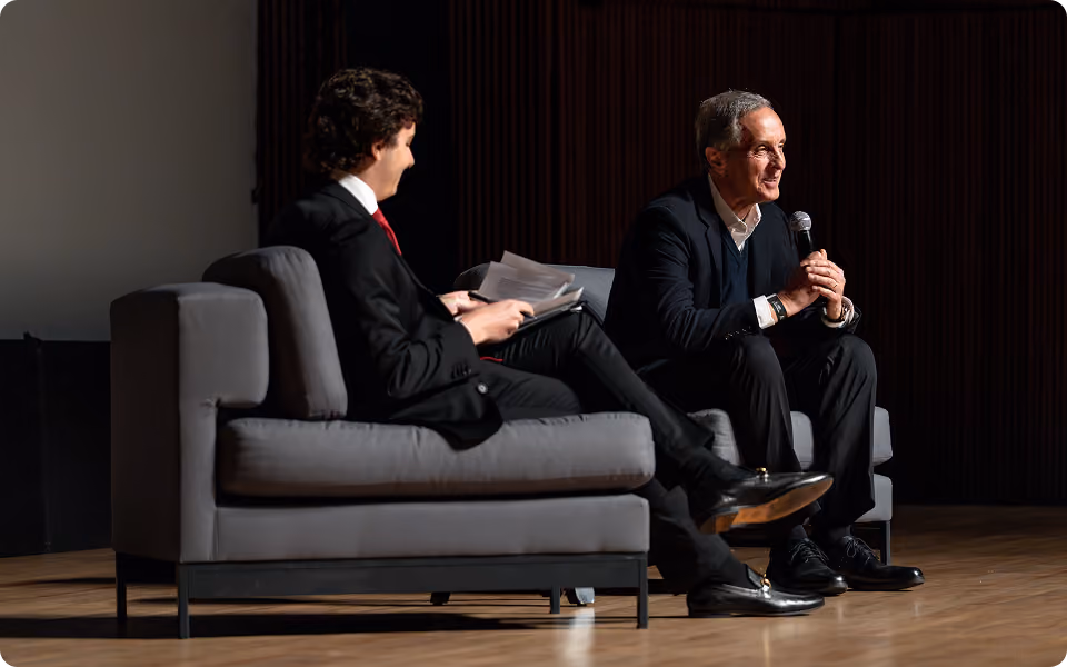 Two speakers in conversation on stage at the Medical Intelligence Summit
