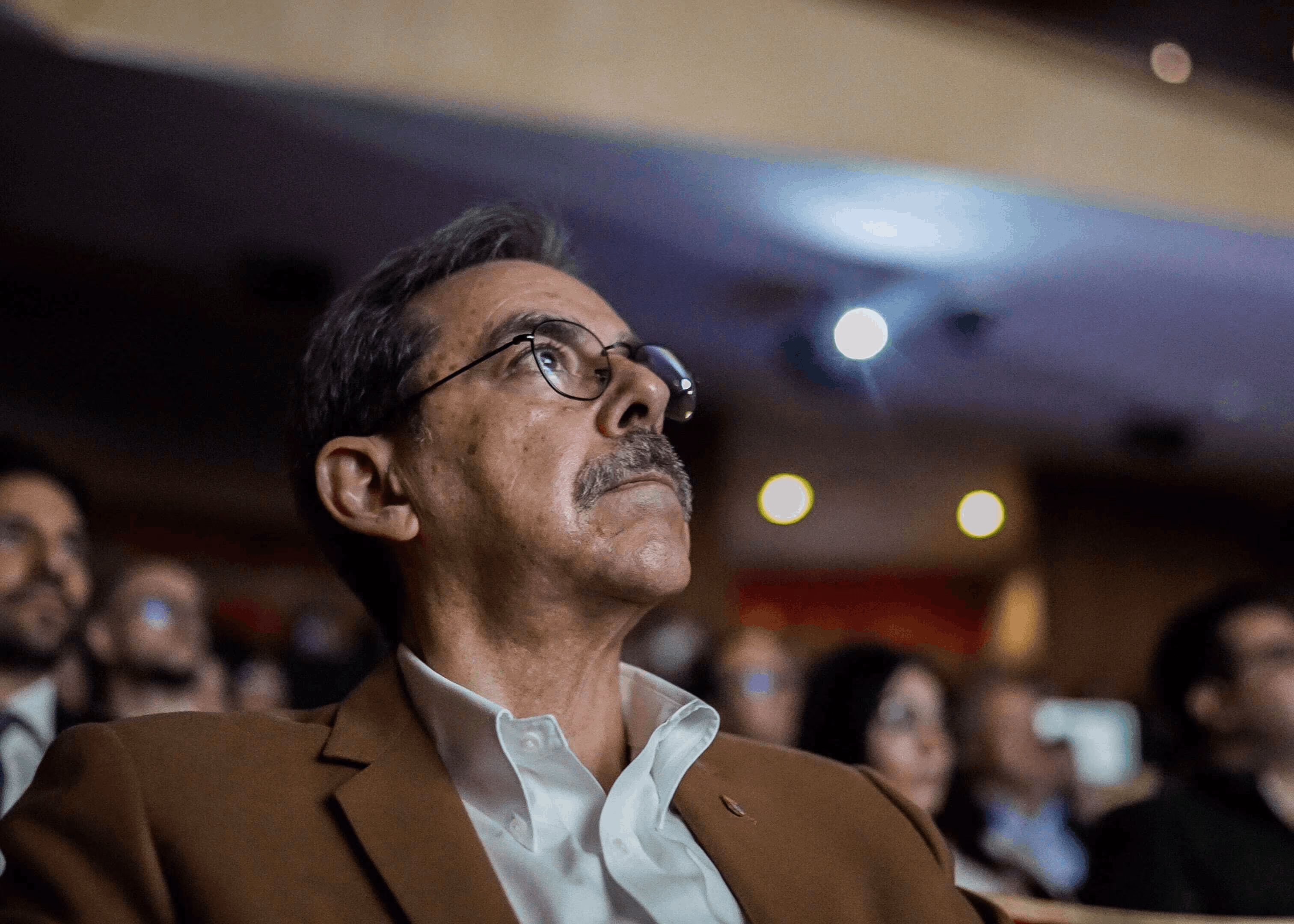 Attendee listening to a talk at the Medical Intelligence Summit