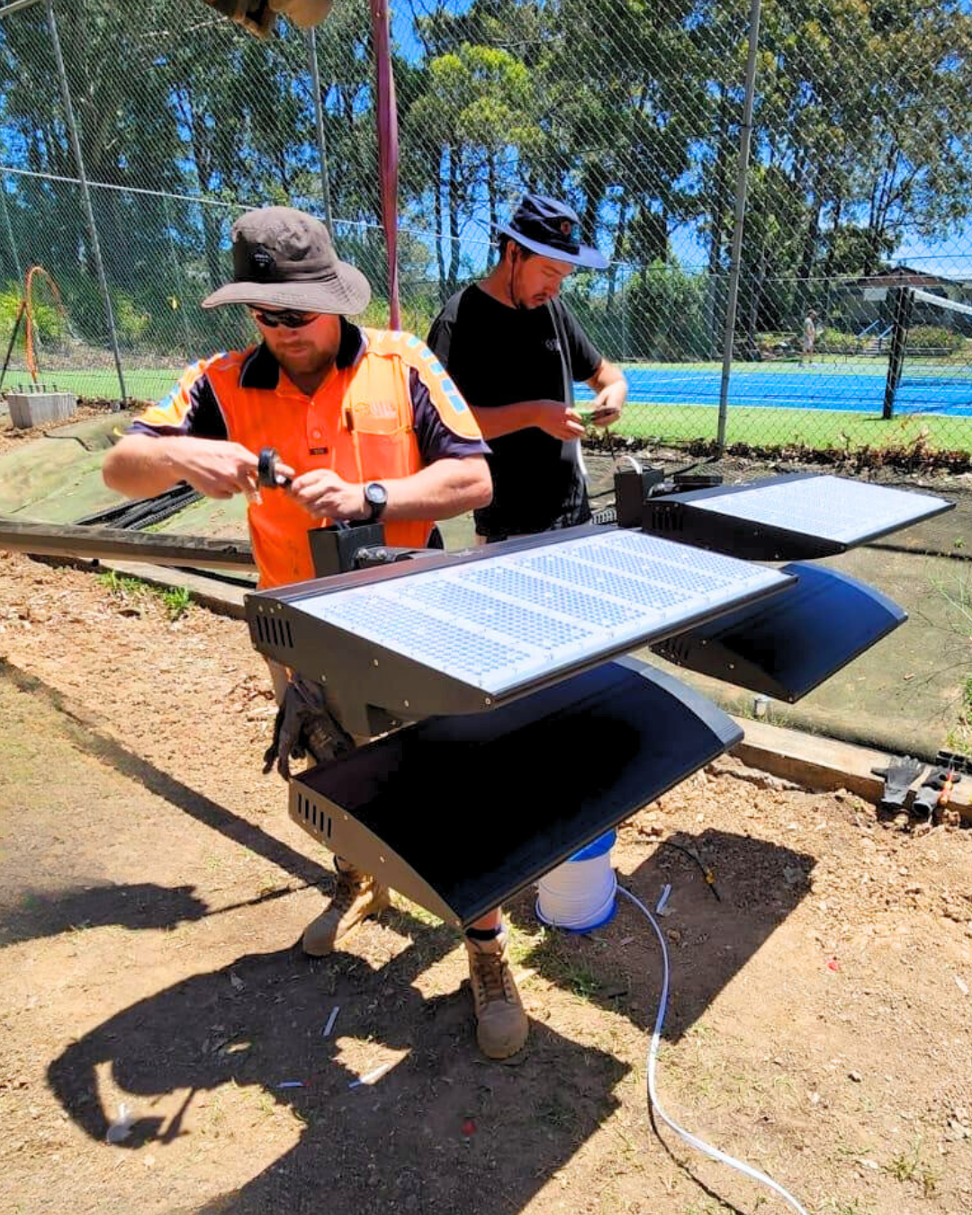 image of a technician installing solar panels