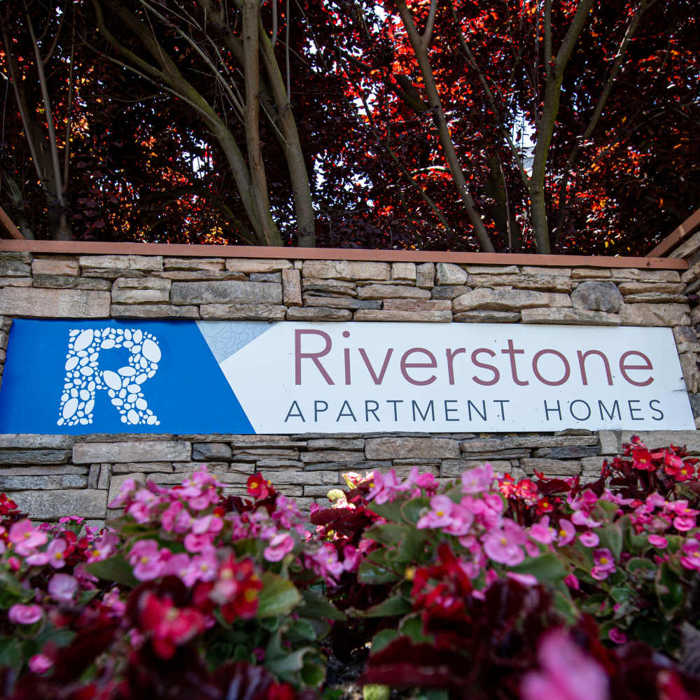 Riverstone exterior sign with flowers
