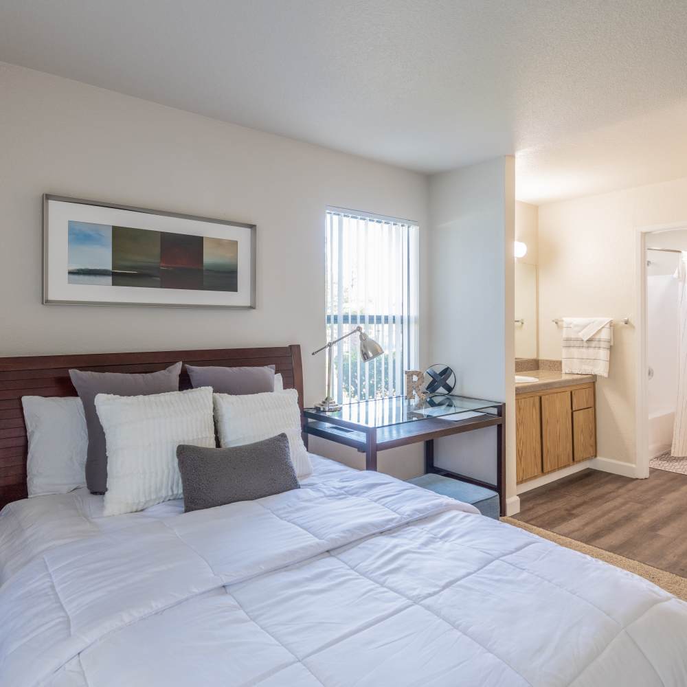 Bedroom with bed and view of bathroom